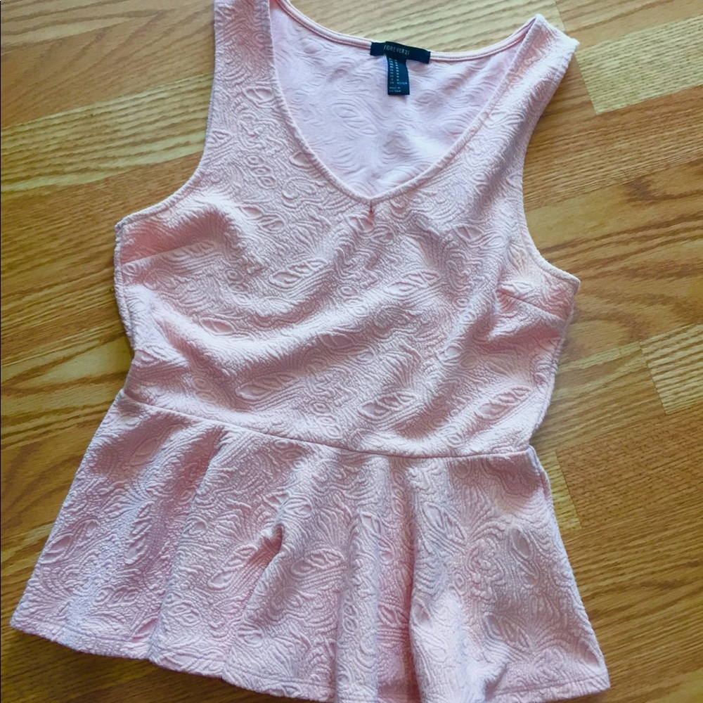 Pink peplum sleeveless blouse